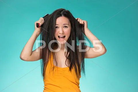 Frustrated young woman having a bad hair Stock Photos