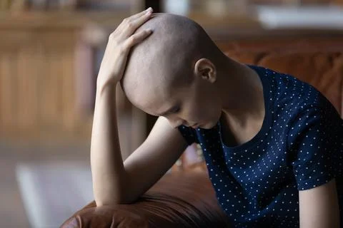Frustrated young woman tired of cancer chemotherapy, feeling hopeless Stock Photos