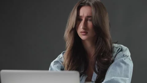 Frustration and stress concept, young woman working on laptop with confused and Stock Footage 337005454