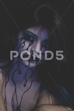 Frustration, representation of sadness, beautiful woman with painted tears on Stock Photos