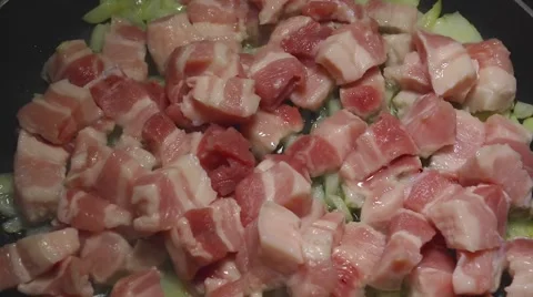 Fry the bacon and onion in a pan Stock Footage 46294992