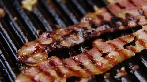 Fry the bacon on the grill Stock Footage 73829813