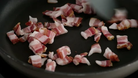 Fry bacon with leeks and butter in a frying pan. Stock Footage 153407420