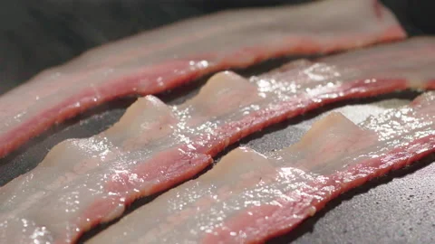 Fry bacons on hot pan Video stock 158431132