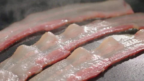 Fry bacons on hot pan slow motion Stock-Footage 158431094
