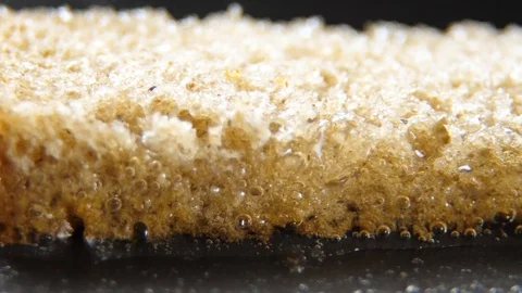 Fry bread slice in oil, closeup Stock Footage 88070903