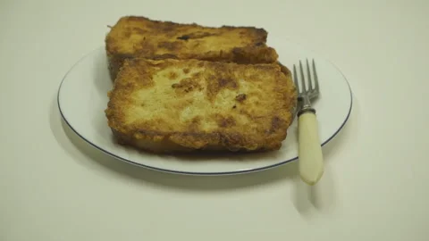 Fry bread slice in oil, closeup. boiling oil while frying bread . Stock Footage 96292466