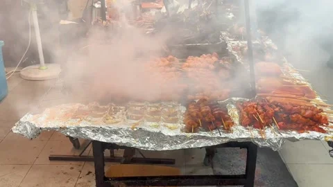 Fry chicken, fish ball in open night food market in Brunei Stock Footage 235571838