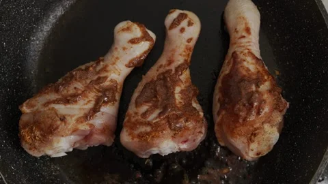 Fry chicken legs in a frying pan Stock Footage 316510526