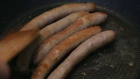 Fry delicious sausages Stock Footage 74799078