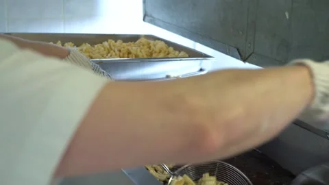 Fry the dough in a deep fryer close-up Stock Footage 221818085
