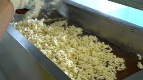 Fry the dough in a deep fryer close-up Video stock 228051289