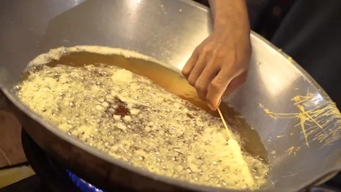 Fry the egg rolls in a large skillet Stock Footage 265934305