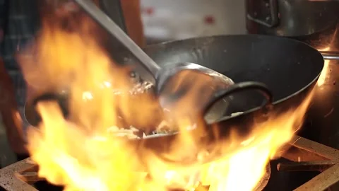 Fry eggs and vegetables over high heat Stock Footage 265934631