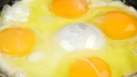 Fry eggs in frying pan, close up Stock-Footage 242083691