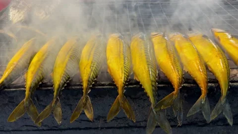 Fry fish in open night food market in Brunei Stock Footage 235570022
