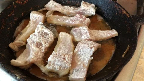 Fry fish in a pan Stock Footage 116467711