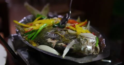 Fry fish with vegetables Fried crispy crucian carps.Preparing Fish in Frying Pan Stock Footage 314497617