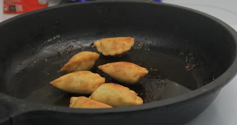 Fry in a frying pan Stock Footage 145423925