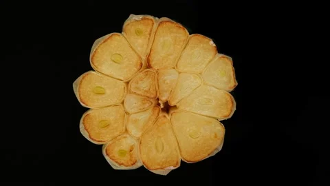 Fry garlic isolated on black background, rotation 스톡 동영상 165089870