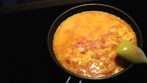 Fry a large portion of scrambled eggs Stock Footage 120719999