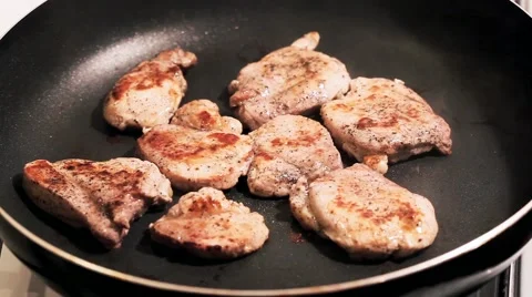 Fry the meat in a frying pan, Chef preparing and spicing meat restaurant kitchen Stock Footage 65449208