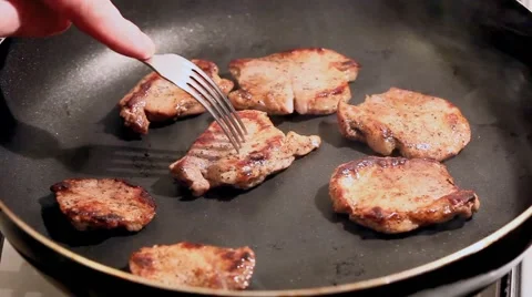 Fry the meat in a frying pan, Chef preparing and spicing meat restaurant kitchen Stock Footage 65449272