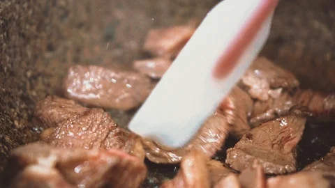 Fry meat in a pan. Stock Footage 105319888