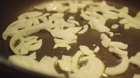 Fry onions in a pan, close-up Stock Footage 95433520