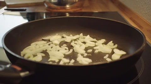 Fry onions in the pan Stock Footage 95432499