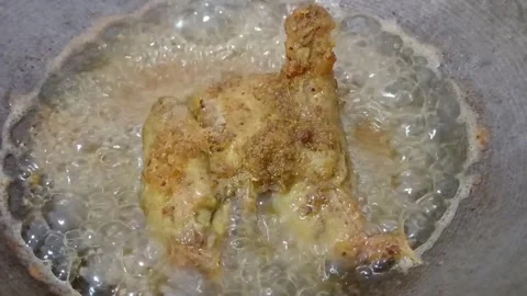 Fry a piece of fried chicken with spices. Original spices are formulated to.. Stock Footage 273962855
