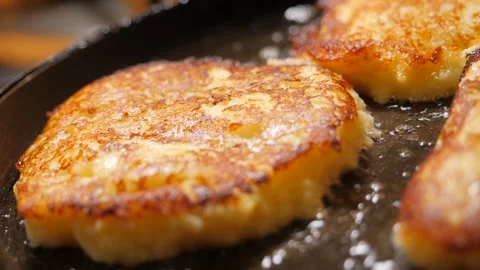 Fry potato pancakes on a pan. Stock Footage 242096541