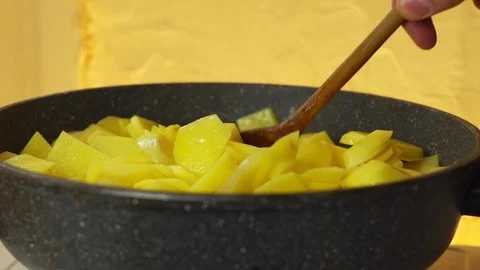 Fry potatoes in a pan Stock Footage 104132960