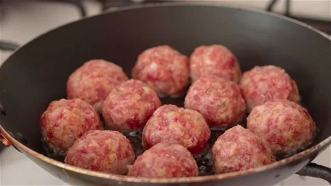 Fry raw meatballs in pan close up Stock Footage 108328961