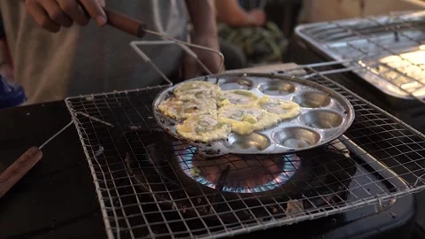 Fry round mini egg martabak Stock Footage 265934236
