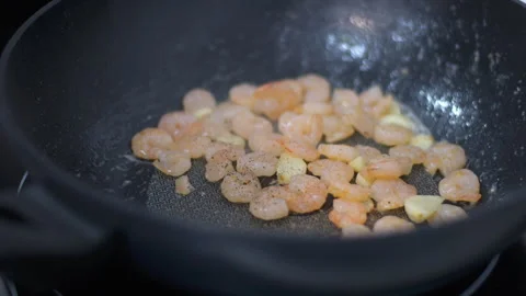 Fry shrimp in a pan Process of fries shrimp in pan with olive oil and garlic in Stock Footage 285157859