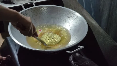 Fry some crackers in hot oil in a pan Stock Footage 274517367