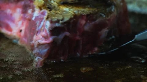 Fry the steak turn it over Stock Footage 247578039