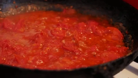 Fry tomatoes.Mix fried tomatoes Stock Footage 80016366