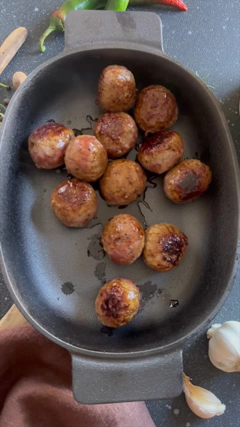 Fryed meatballs on black background, top view, Stock Footage 256052306