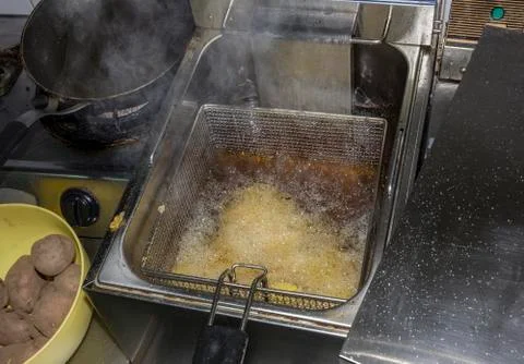 Fryer for potatoes Stock Photos