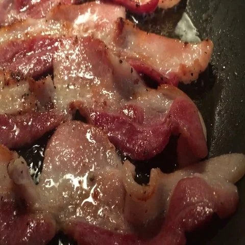 Frying the bacon Stock Footage 69409065