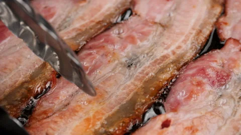 Frying bacon in pan, close up. Traditional breakfast Stock-Footage 221020162