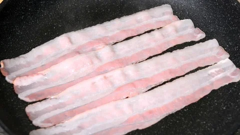 Frying Bacon in a Pan Stock Footage 103744718