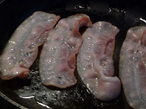Frying bacon Stock Photos