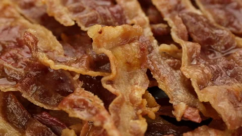 Frying bacon slices close up, rotation Video stock 246534315
