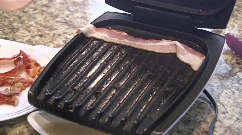 Frying bacon strips 02 Stock Footage 44259481
