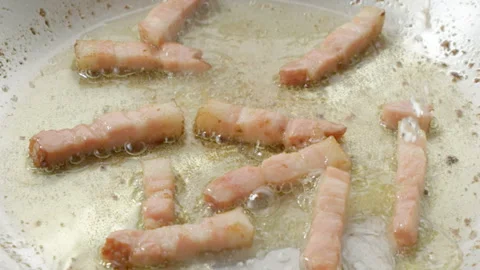 Frying Bacon with White Wine Stock Footage 327411804