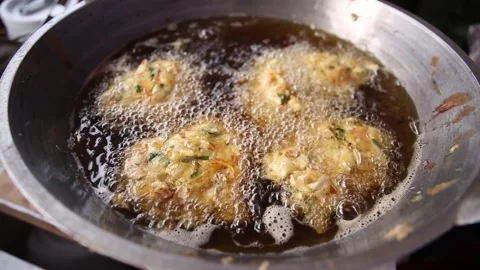 Frying bakwan in a frying pan close up Stock Footage 273040600