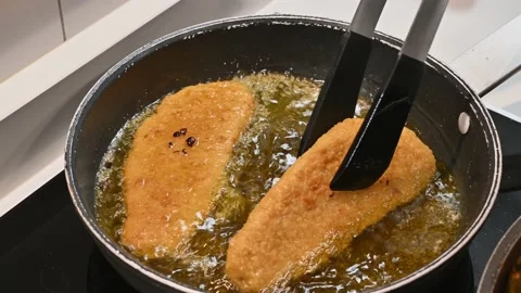 Frying battered fish in oil Stock Footage 219875670